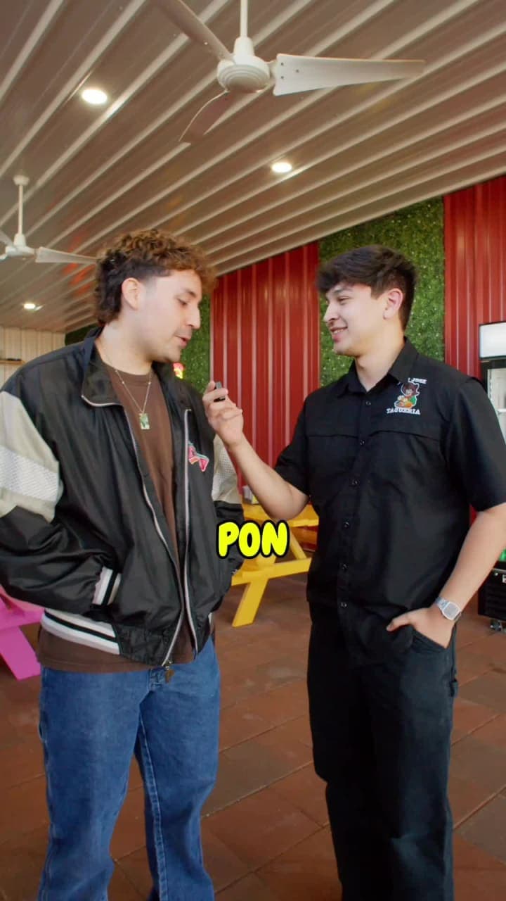 Two guys talking tacos inside a taquería in Mission, Texas
